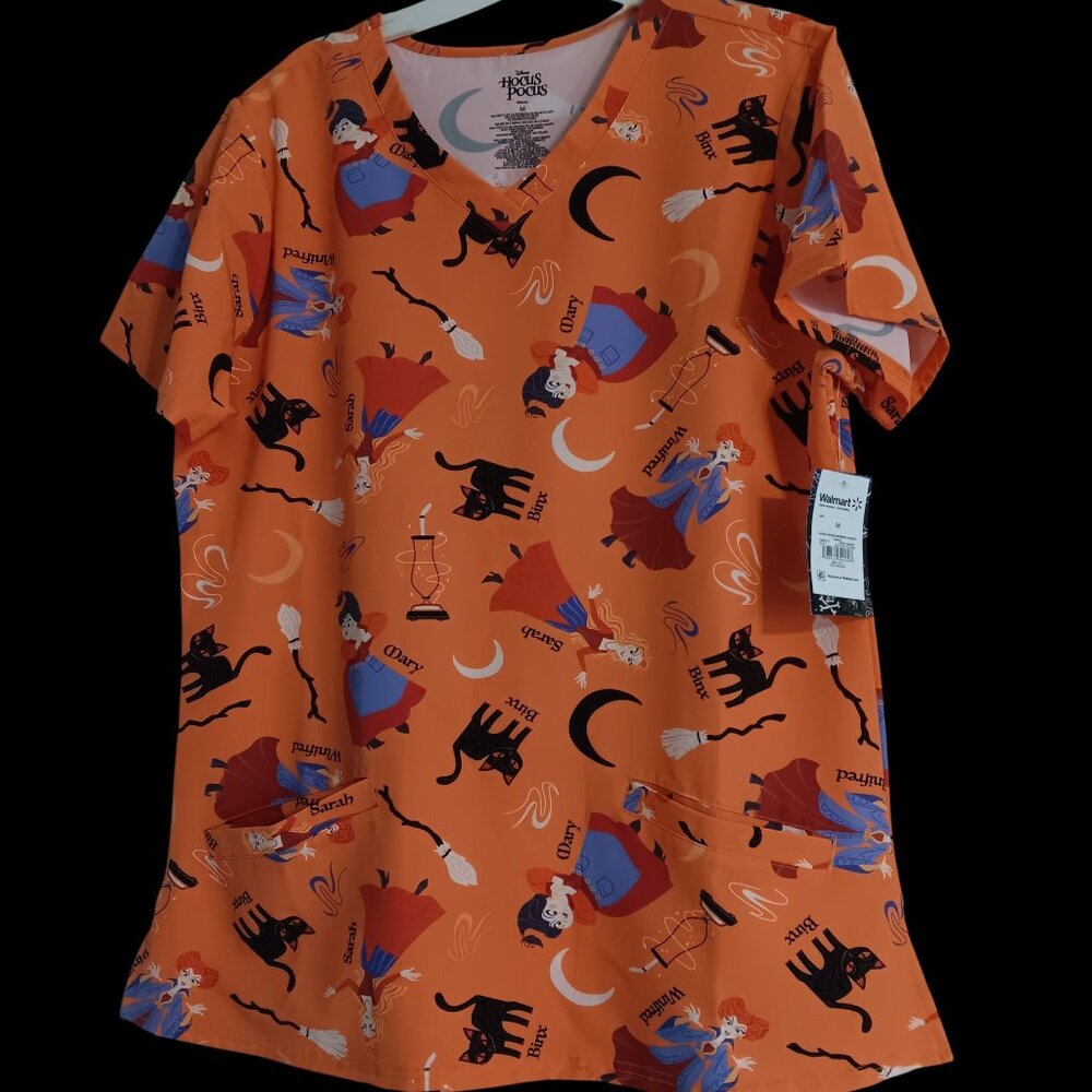 Disney  Orange Hocus Pocus pattern woman's scrubs top, size Medium, 2 pockets